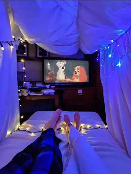 A beautifully decorated room for movie night by a couple. 