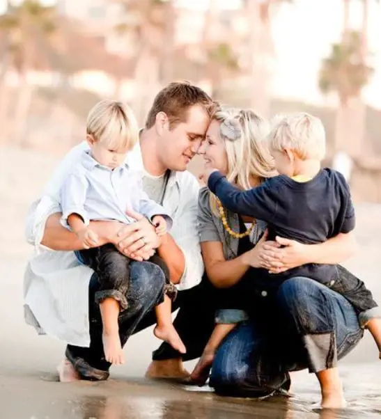 Parents with their children embrace each other as they showcase their love