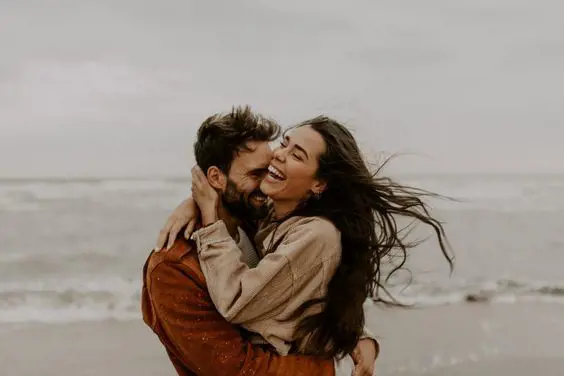 Couple embraces each other with love while the moment is captured by Vanessa Toth