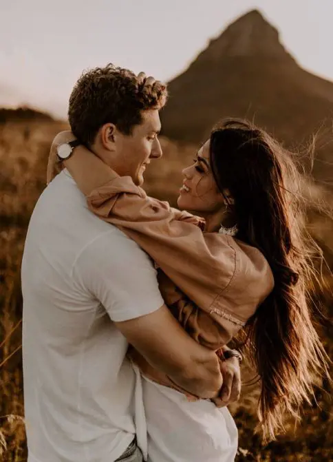 Lovers embraces each other as they look into each others eyes and the perfect moment being captured by Vanessa Toth