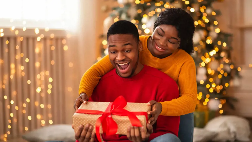 Girl surprising her mate with Christmas present