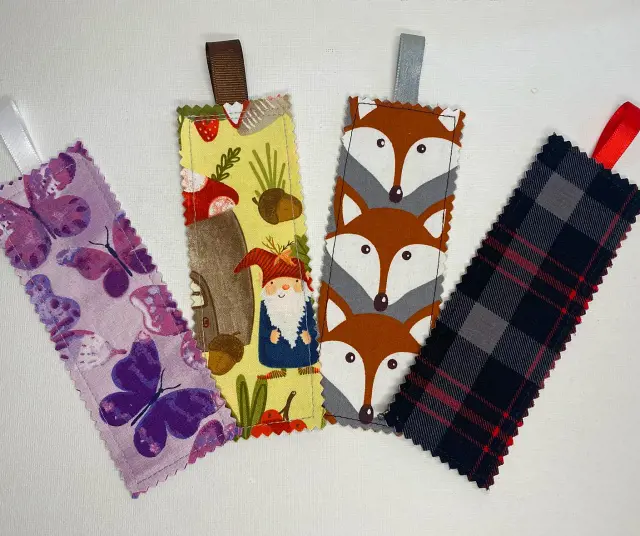 Colorful handmade fabric bookmarks with different textures and designs