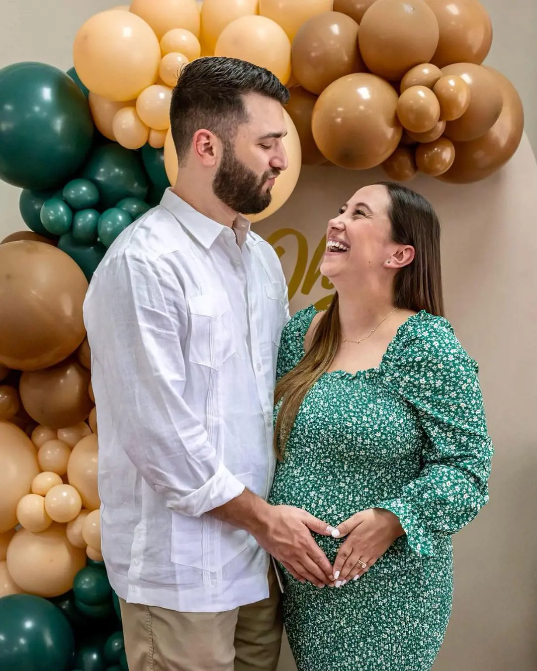 Pair embrace each other with joy and happiness during the baby shower