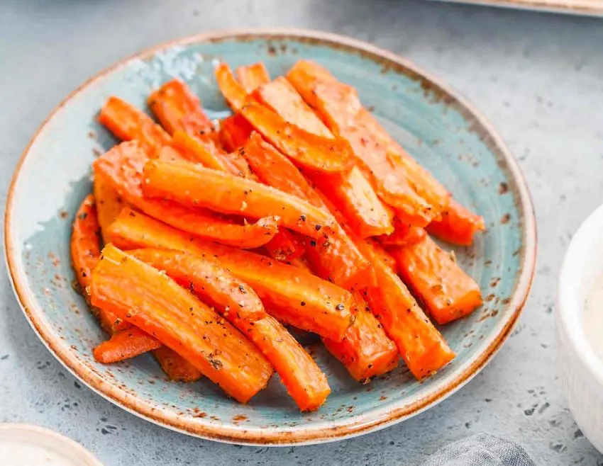 Carrot cut into thin pieces not bigger than a human finger