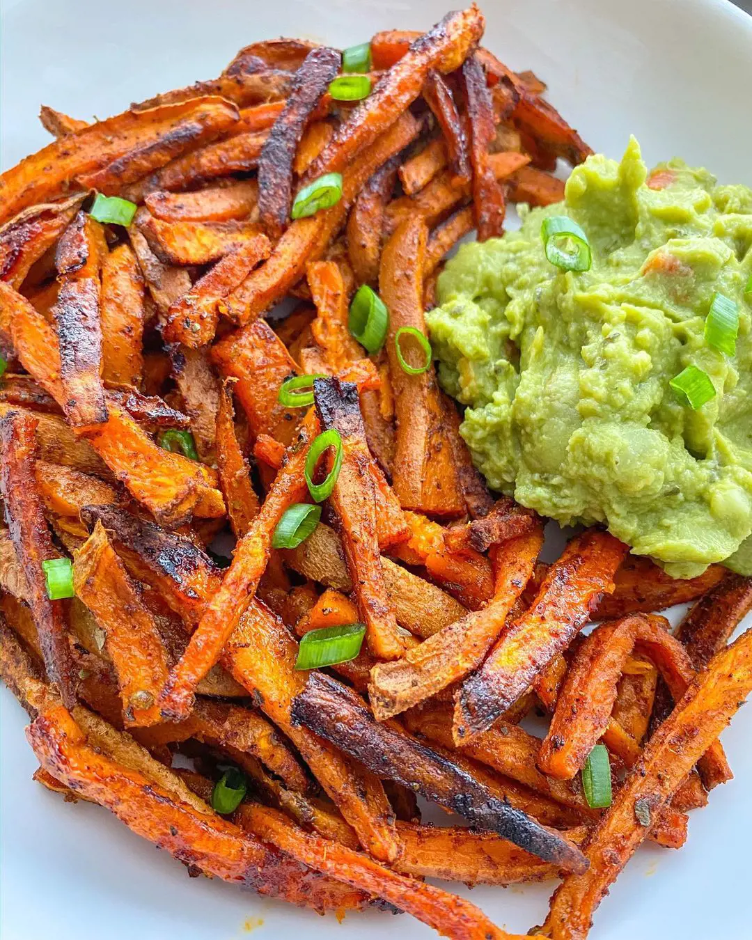 Delicious sweet potato fries served with garlic and dried oregano sauce