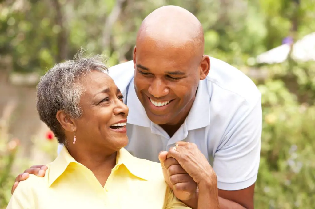 A Man happily engaging in conversation with his mom