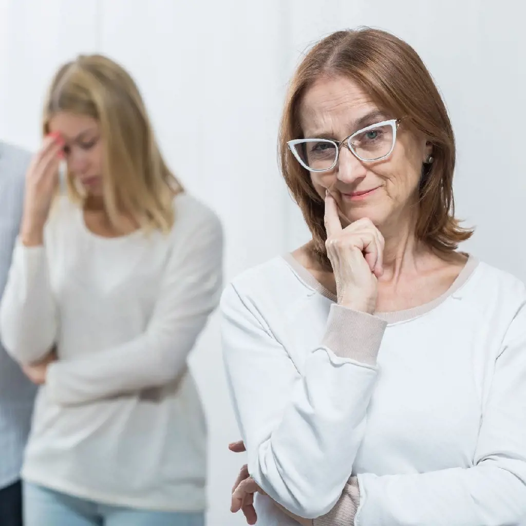 Partner in distressed in the back when a mom is smiling proudly