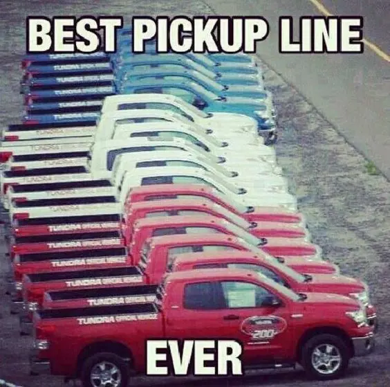 A color graded line of Pick-Up trucks parked at a parking lot.